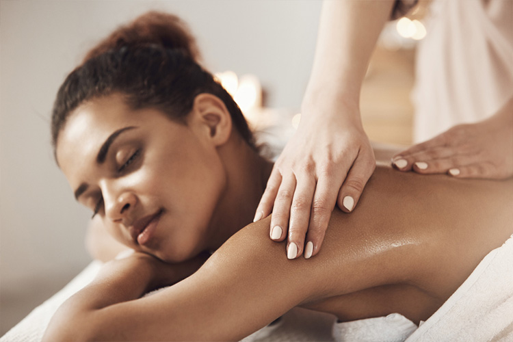 Relaxing SPA treatment room with candles and towels